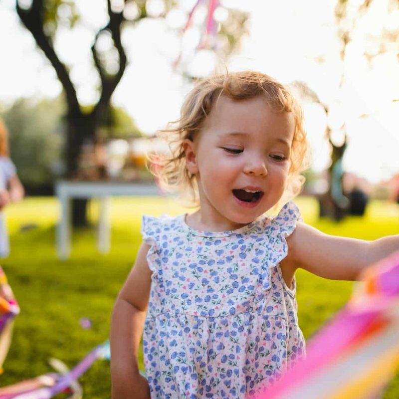 a-front-view-of-small-girl-on-birthday-party-outdoors-in-garden-in-summer-.jpg